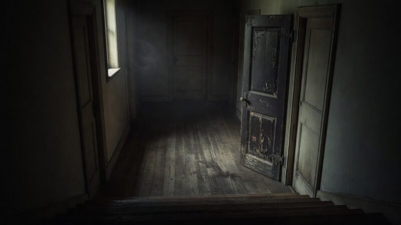 An upstairs hallway with an mysterious fourth door